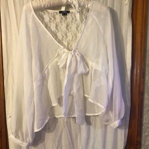 Beautiful blouse. Ties in the front, lace in back. V-neck